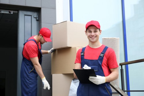 Loading household items into a moving truck in Forestdale