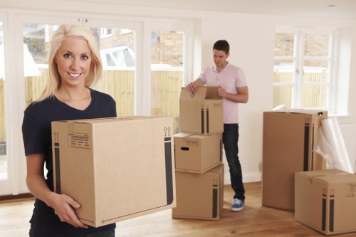 Forestdale removals crew unloading boxes and furniture at a new home