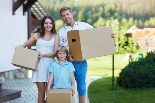 Packed moving boxes and furniture ready for transport in Forestdale