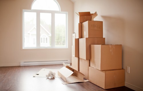 House removal truck and movers in a Forestdale residential street