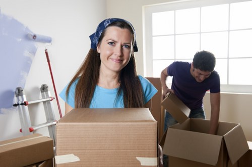Local movers handling boxes and furniture during a Forestdale relocation