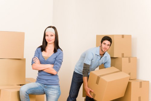 Loading furniture into a removals van in Forestdale