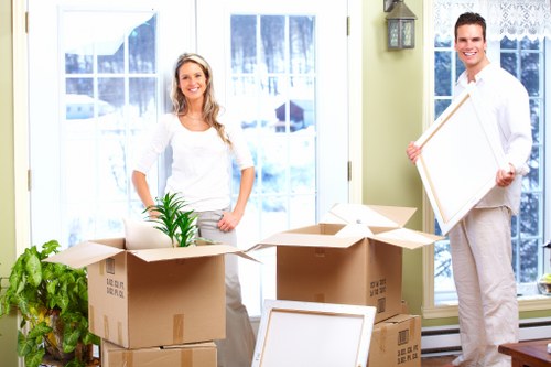 Office movers handling equipment in a Forestdale commercial building
